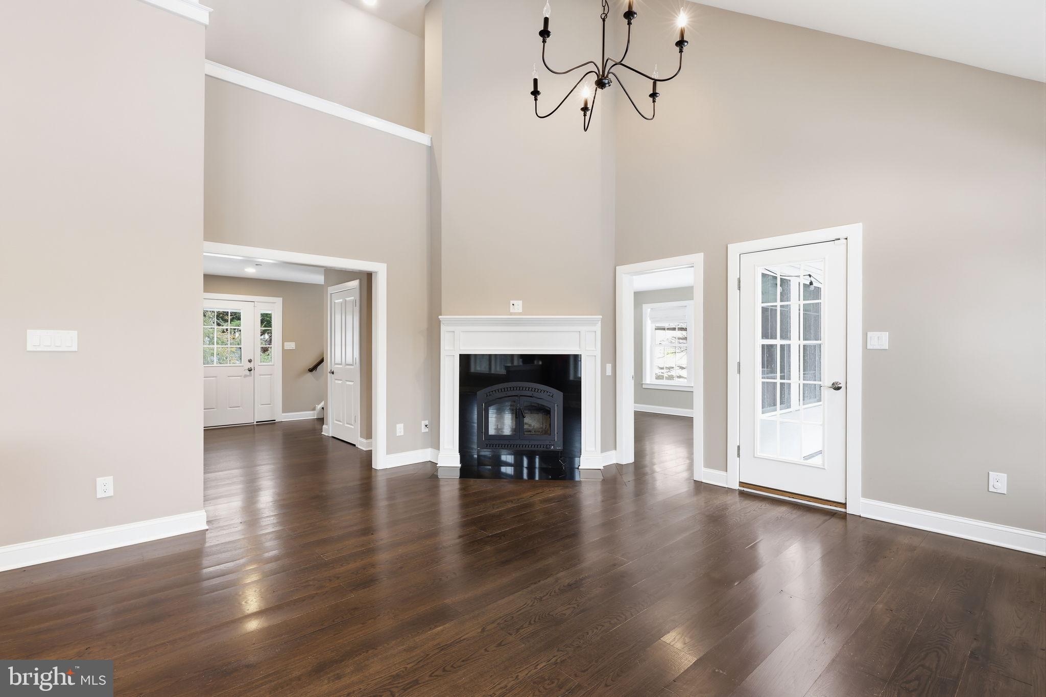 3039 Durham Road Doylestown, PA 18902 - Photo 120 of 122 a view of an empty room with a fireplace and a window
