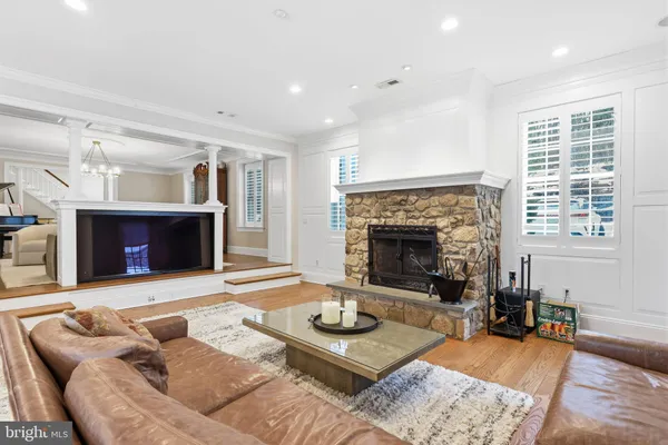 a dining room with furniture a rug a rug and a chandelier