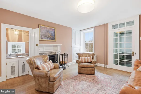 a dining room with furniture window wooden floor and outside view