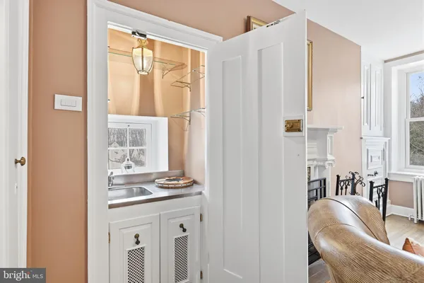a bathroom with a granite countertop toilet sink and mirror