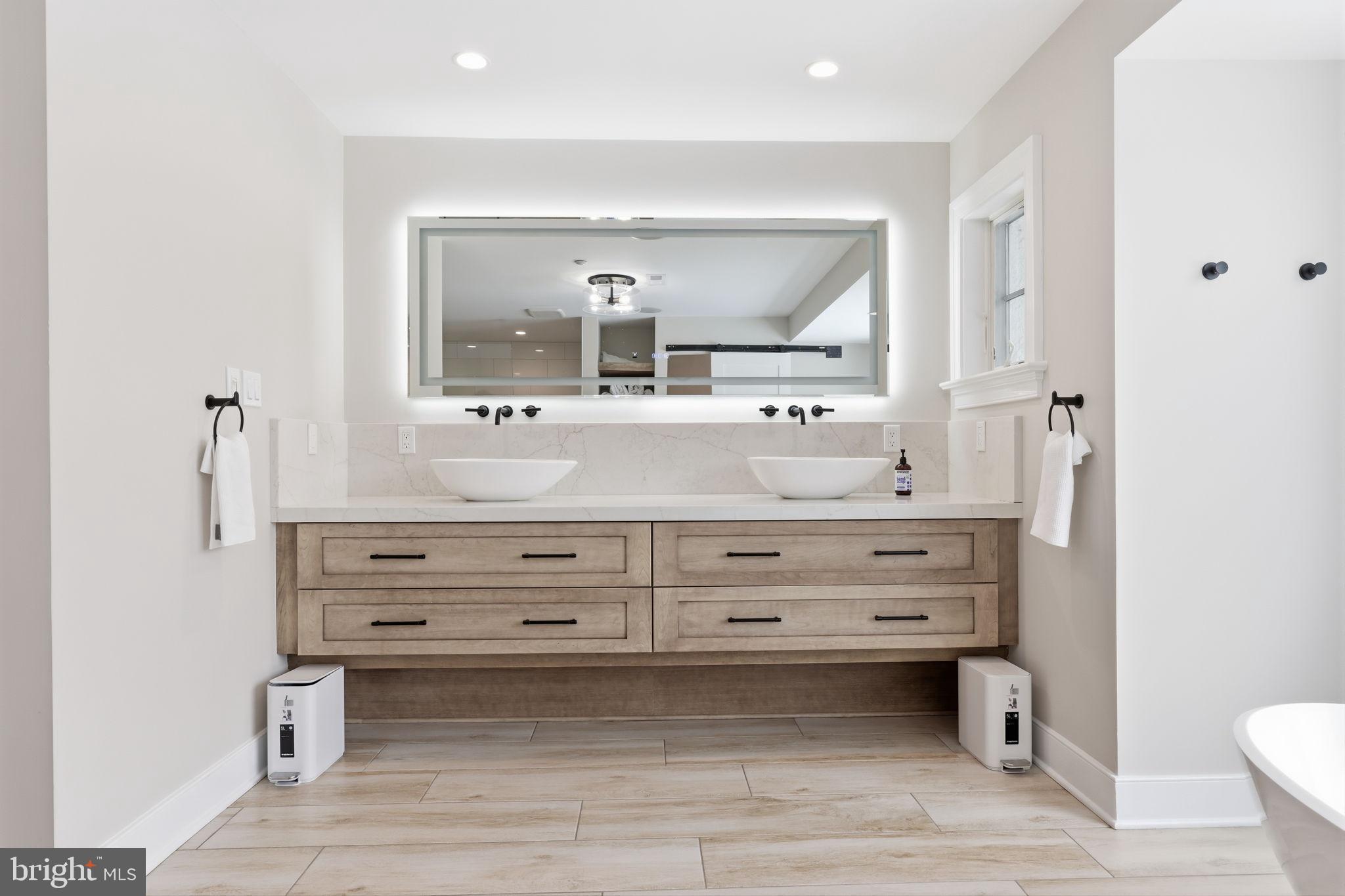 3039 Durham Road Doylestown, PA 18902 - Photo 54 of 122 a bathroom with a vanity toilet a sink and a mirror