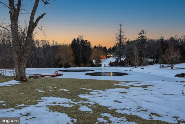 a view of a swimming pool with an outdoor space and seating area