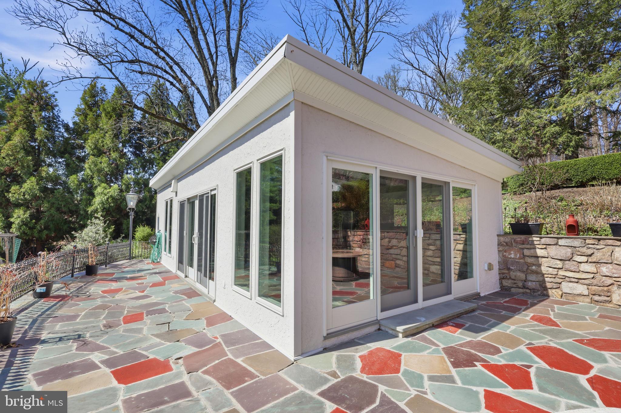 3039 Durham Road Doylestown, PA 18902 - Photo 10 of 122 a view of a patio with a table and chairs and wooden fence