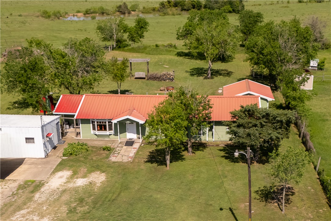 4939 Red Rock Road Bryan, TX 77808 - Photo 1 of 1 aerial view of a house with a yard and lake view