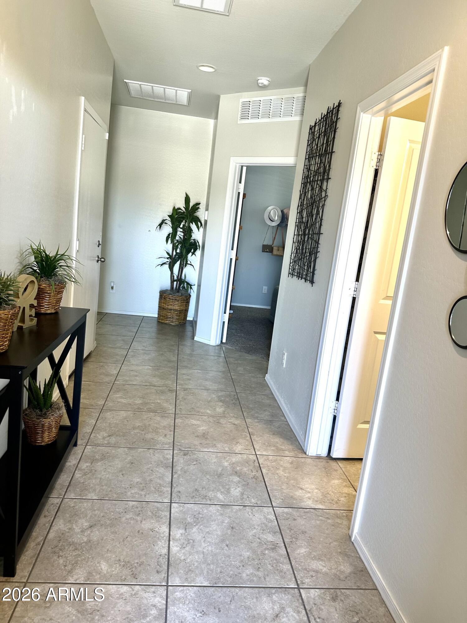 7851 West Riverside Avenue Phoenix, AZ 85043 - Photo 35 of 40 a view of a hallway with furniture and a hallway