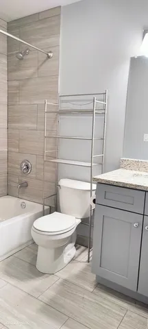 a bathroom with a toilet a sink and a bathtub