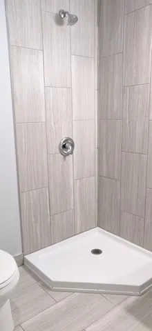 a bathroom with a bathtub and toilet