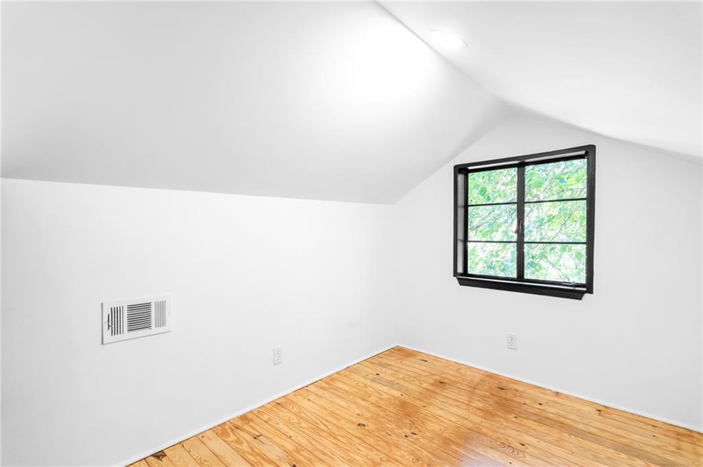 1981 North Decatur Road Atlanta, GA 30307 - Photo 13 of 20 a view of a big room with wooden floor and a window
