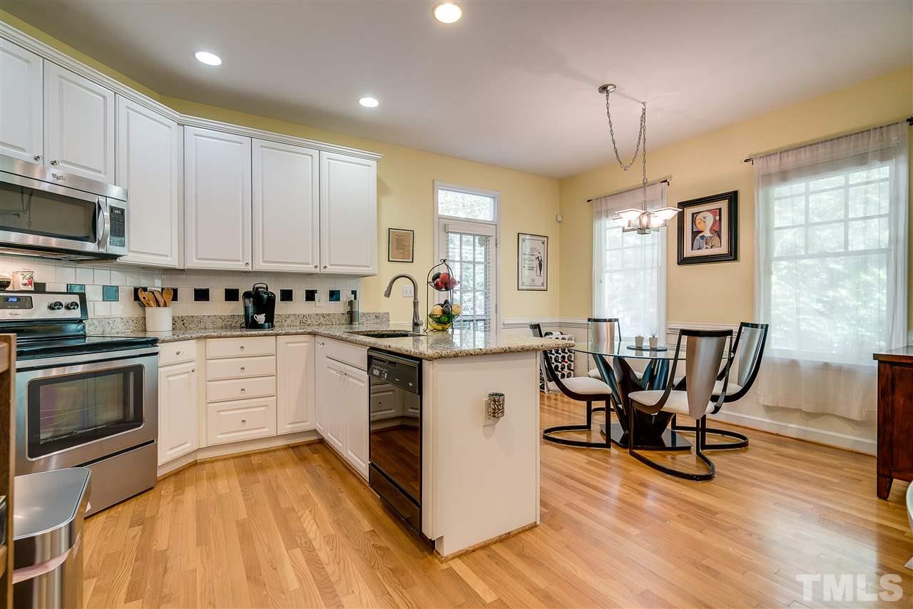 5721 Garrett Road Durham, NC 27707 - Photo 9 of 25 New Granite and Stainless appliances - room at the bar and at the table.