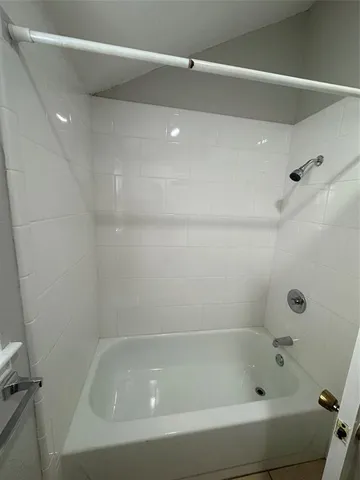 a close up of a bathtub in a bathroom