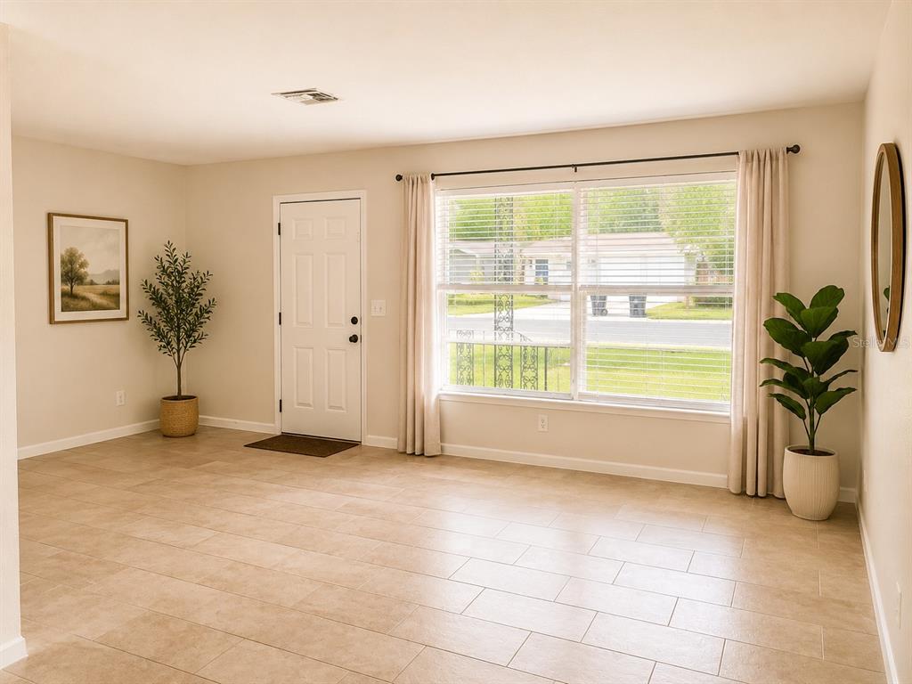 1559 Barry Road Clearwater, FL 33756 - Photo 3 of 20 a view of an empty room with a window