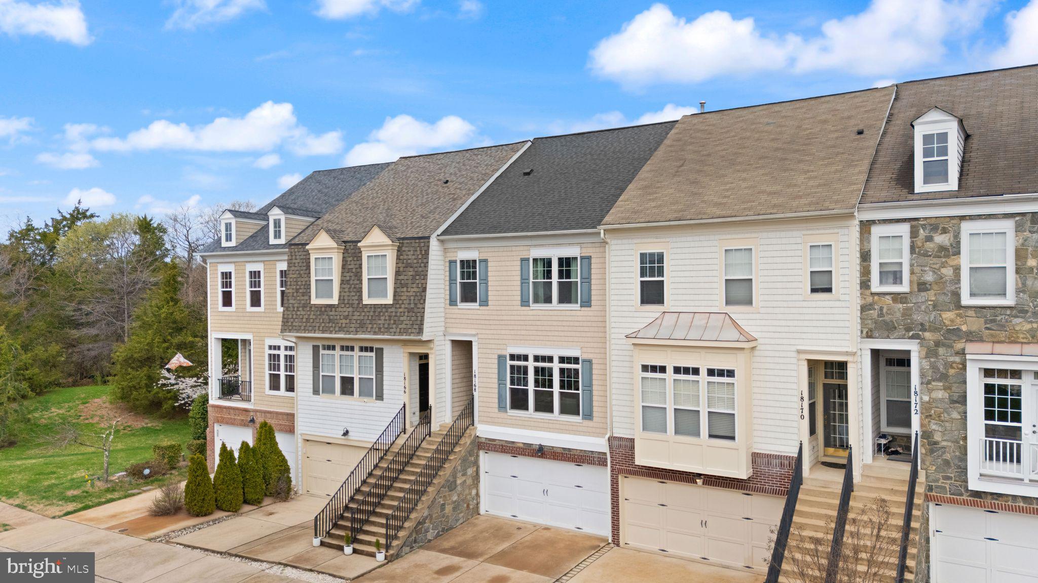 18168 Mill House Square Leesburg, VA 20176 - Photo 2 of 60 a front view of a house with a yard
