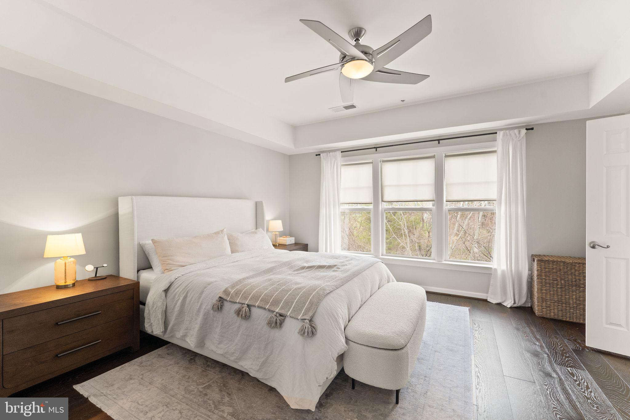 18168 Mill House Square Leesburg, VA 20176 - Photo 23 of 60 a spacious bedroom with a large bed and a large window