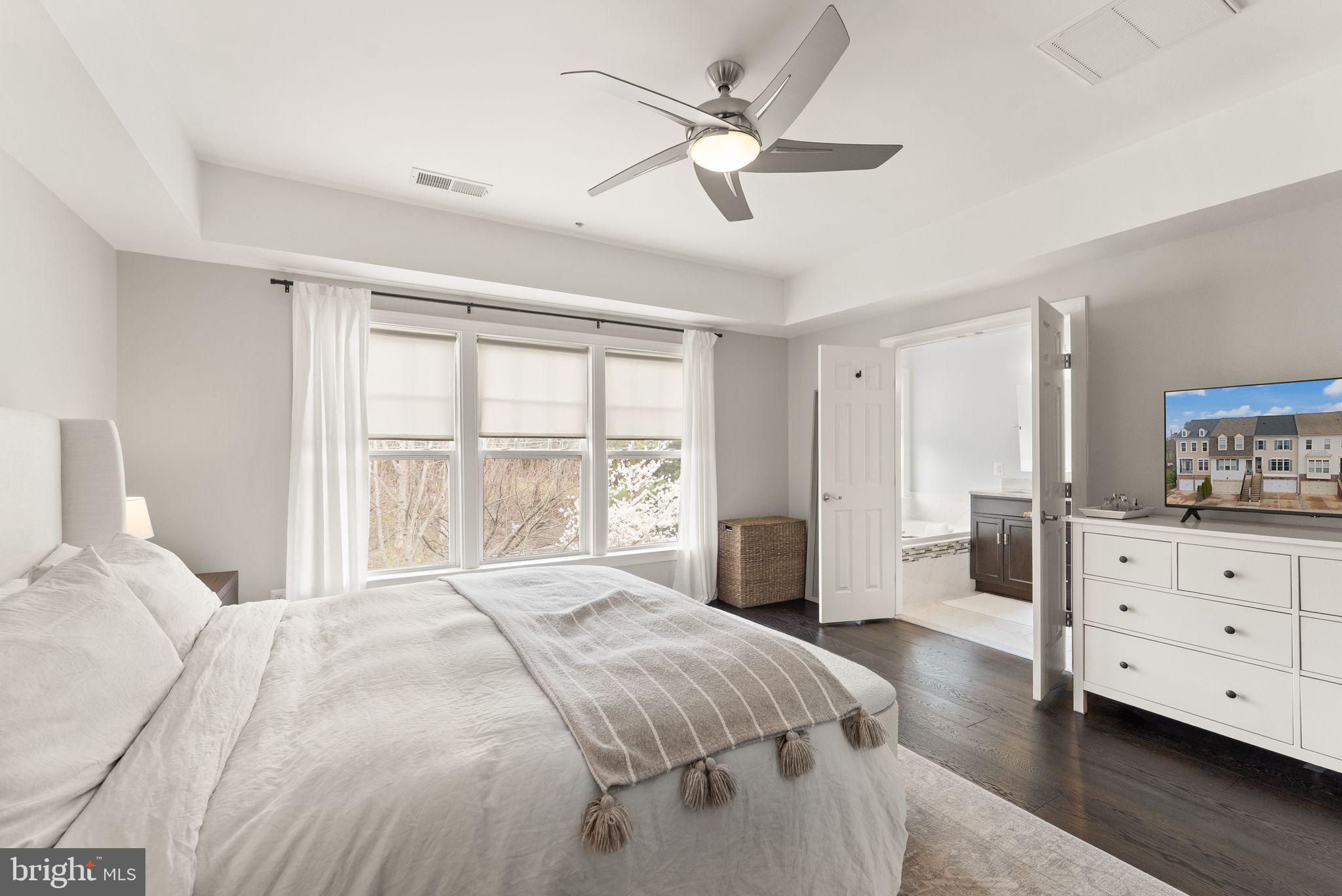 18168 Mill House Square Leesburg, VA 20176 - Photo 24 of 60 a spacious bedroom with a large bed and a dresser
