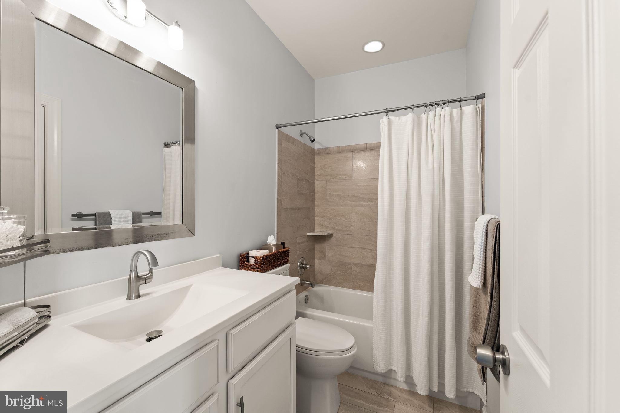 18168 Mill House Square Leesburg, VA 20176 - Photo 33 of 60 a bathroom with a sink toilet and shower
