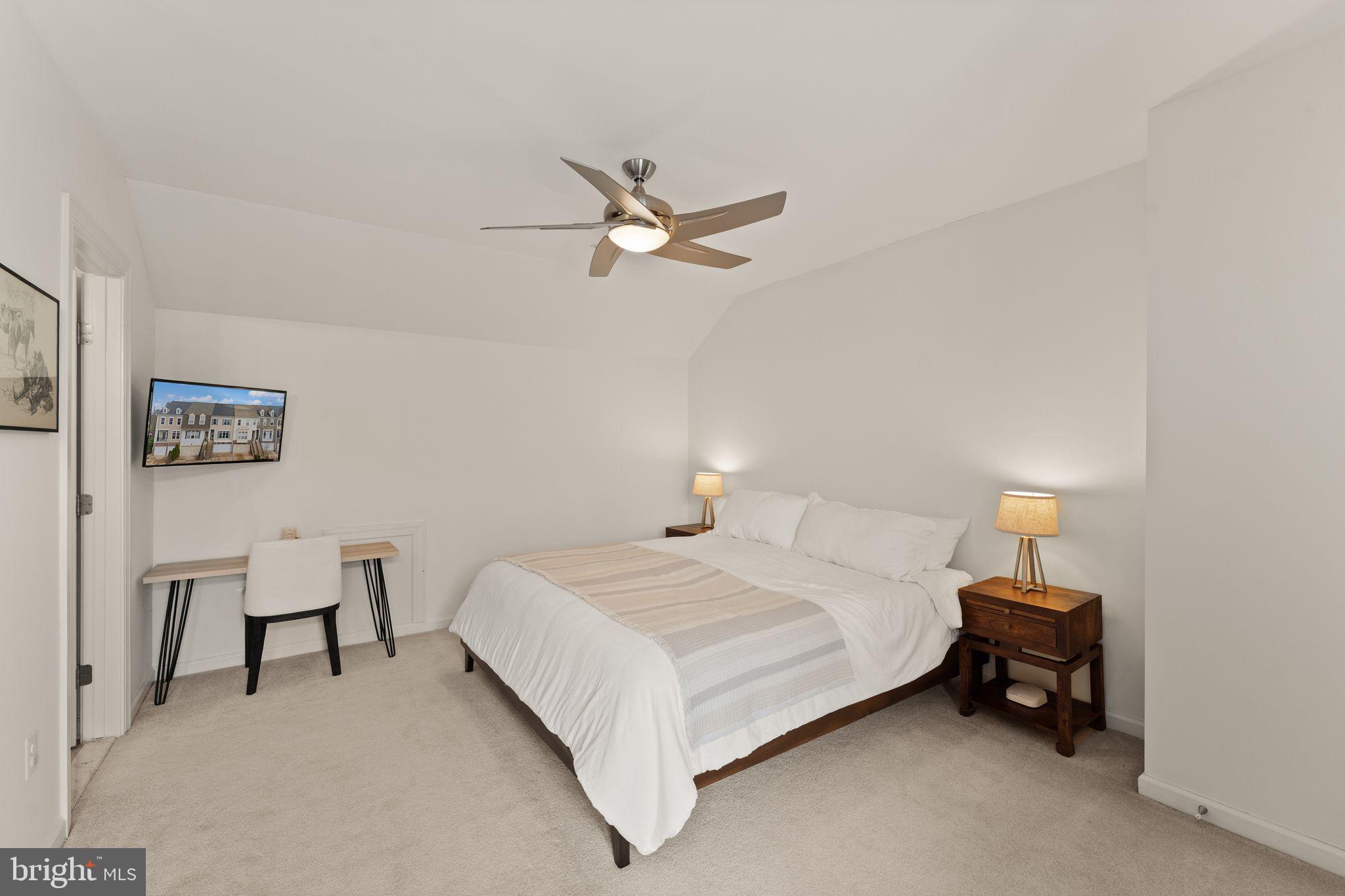18168 Mill House Square Leesburg, VA 20176 - Photo 37 of 60 a bedroom with a bed and a chandelier