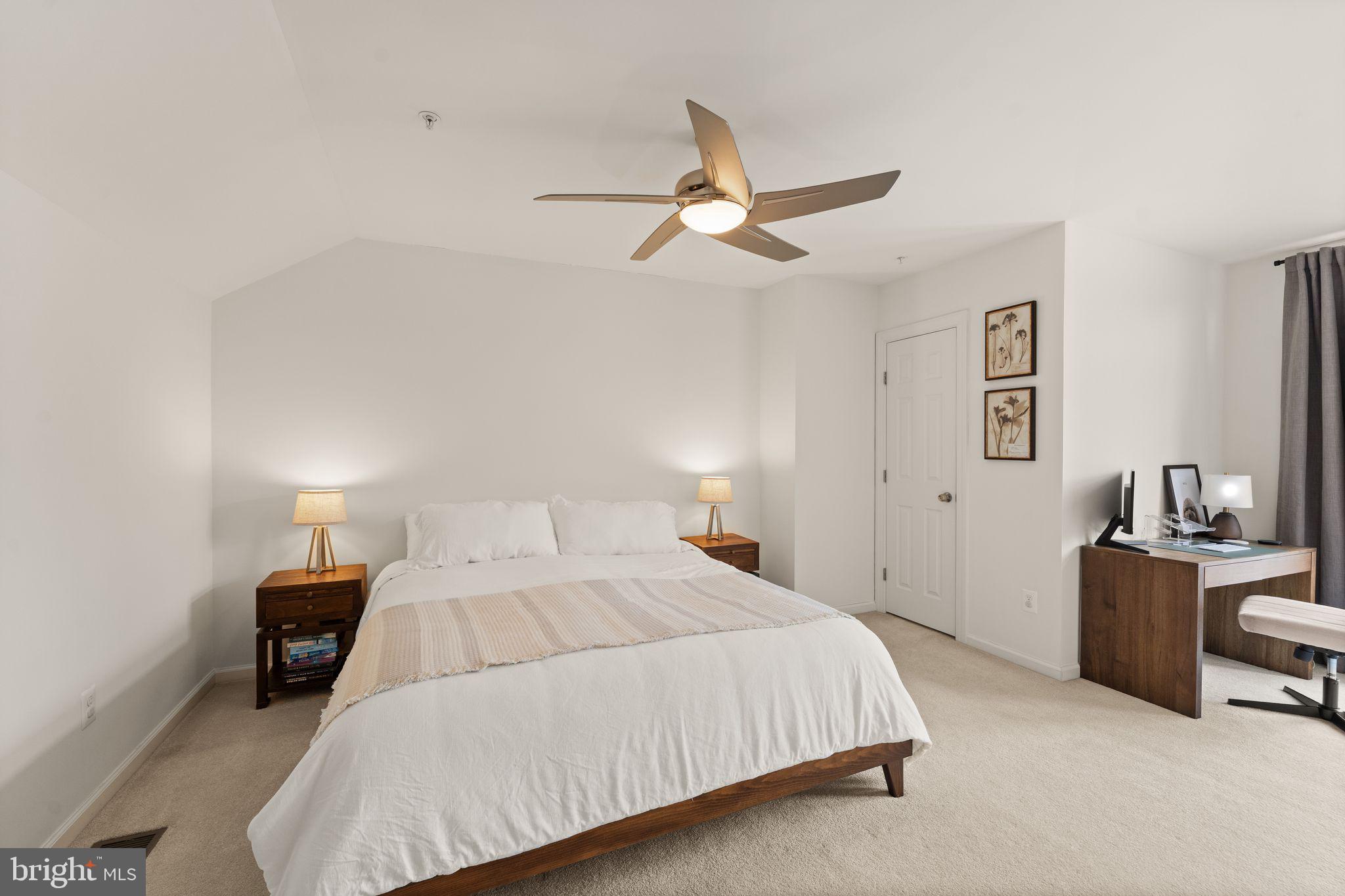 18168 Mill House Square Leesburg, VA 20176 - Photo 38 of 60 a bedroom with a bed and a chandelier