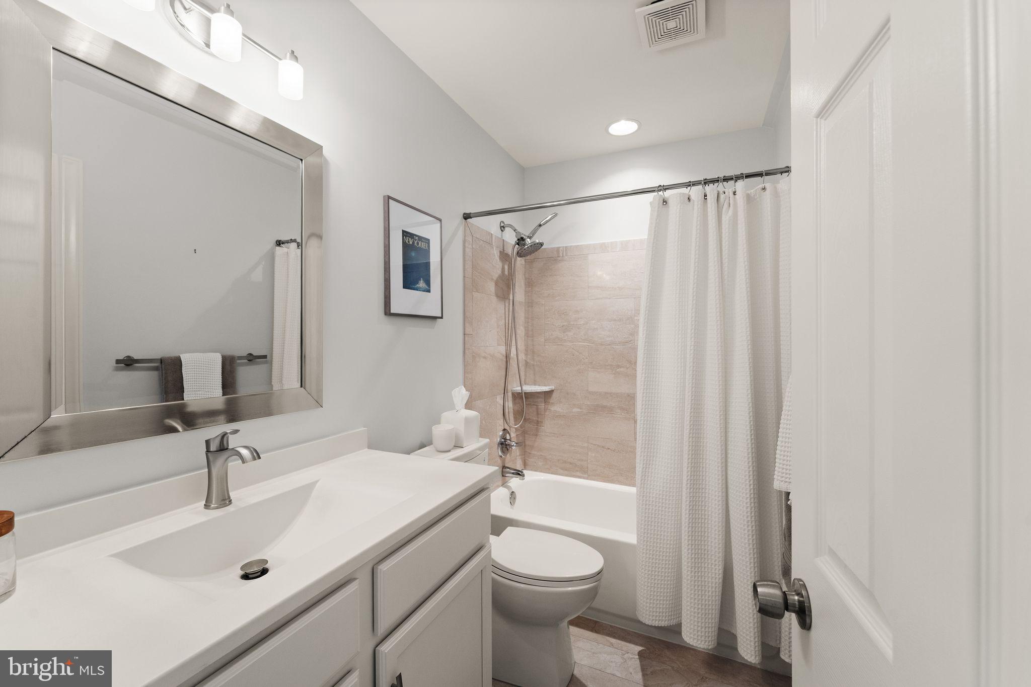 18168 Mill House Square Leesburg, VA 20176 - Photo 39 of 60 a bathroom with a sink mirror toilet and shower