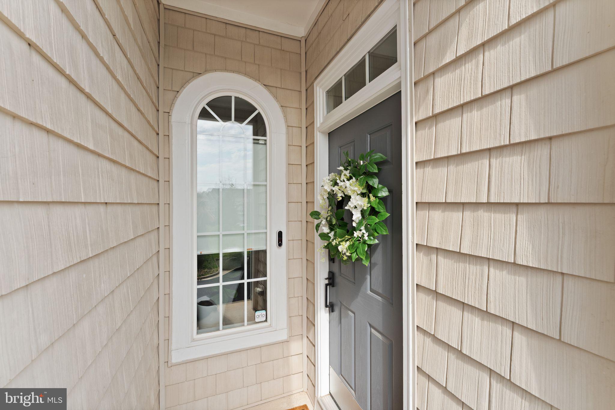 18168 Mill House Square Leesburg, VA 20176 - Photo 4 of 60 a front view of a house with a garden