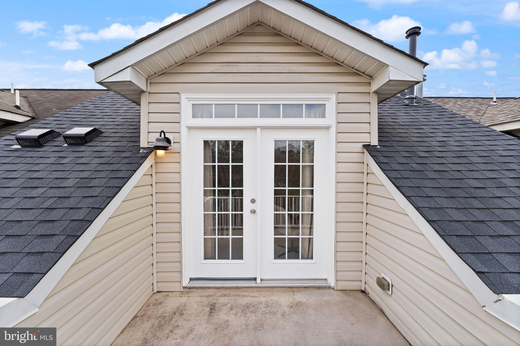 18168 Mill House Square Leesburg, VA 20176 - Photo 41 of 60 a view of a house with a balcony