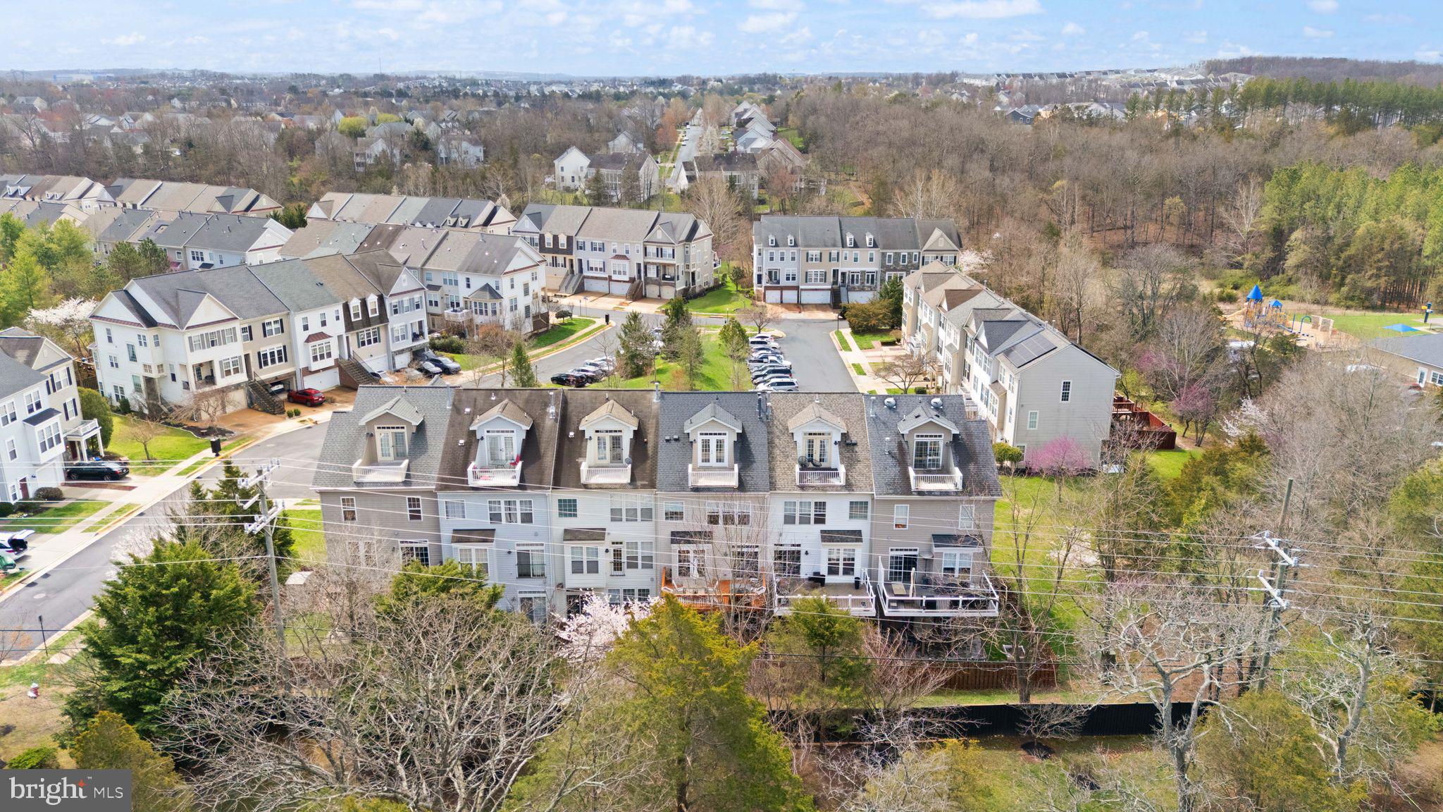 18168 Mill House Square Leesburg, VA 20176 - Photo 54 of 60 a view of a city with tall buildings
