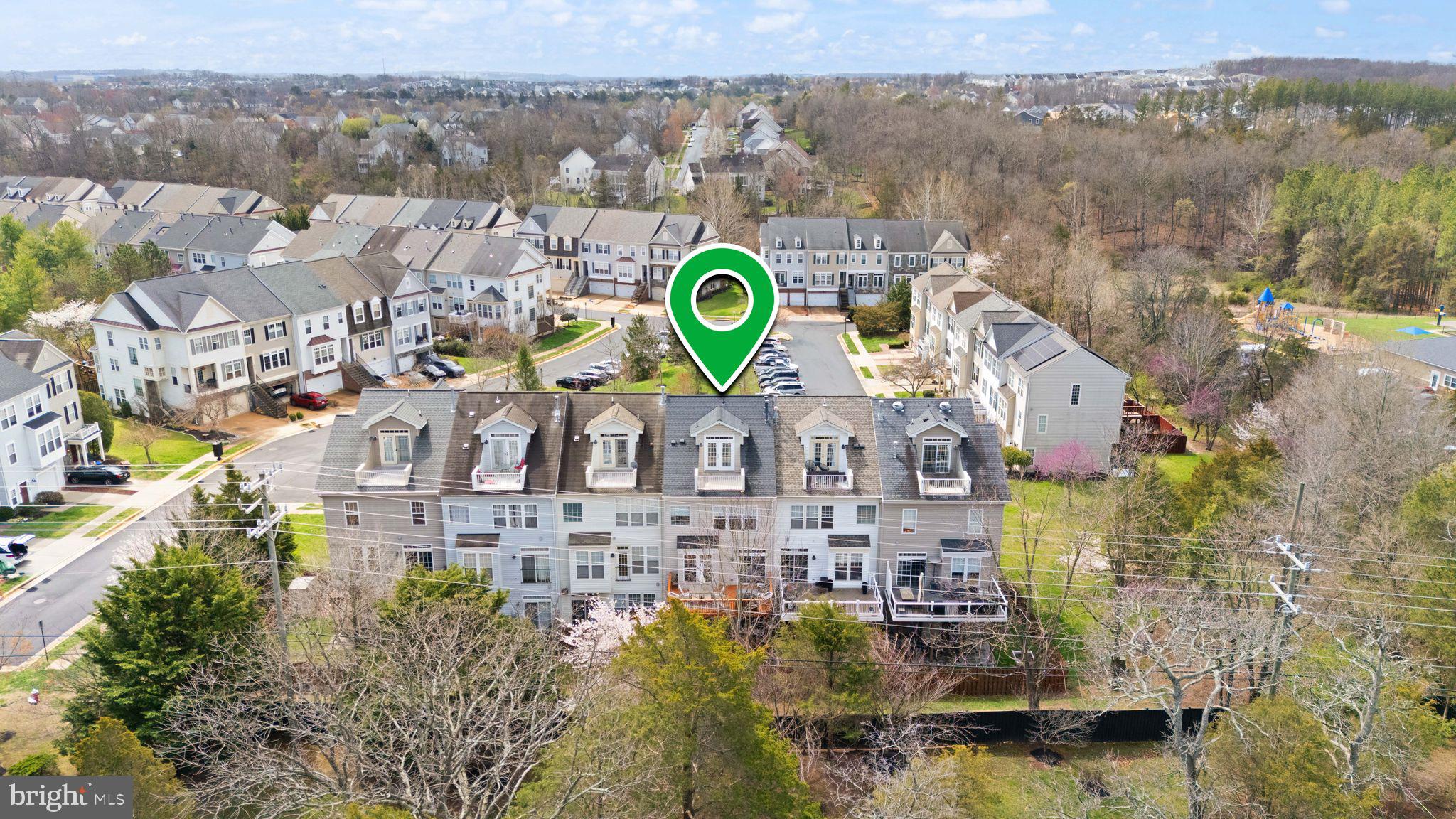 18168 Mill House Square Leesburg, VA 20176 - Photo 55 of 60 a aerial view of a building with a lake view