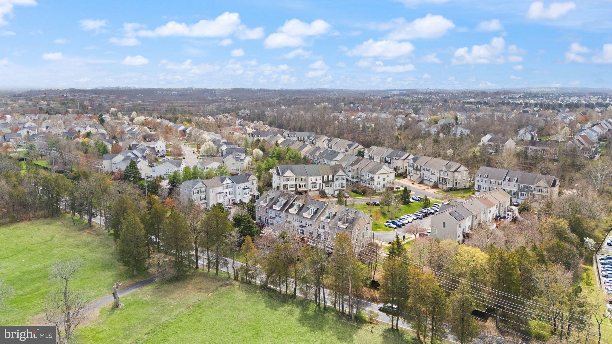 18168 Mill House Square Leesburg, VA 20176 - Photo 57 of 60 an aerial view of residential building with trees