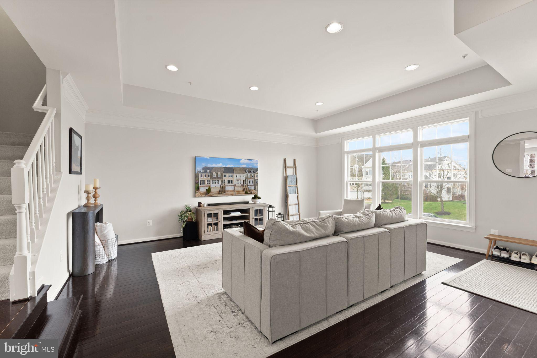 18168 Mill House Square Leesburg, VA 20176 - Photo 7 of 60 a living room with furniture and a flat screen tv