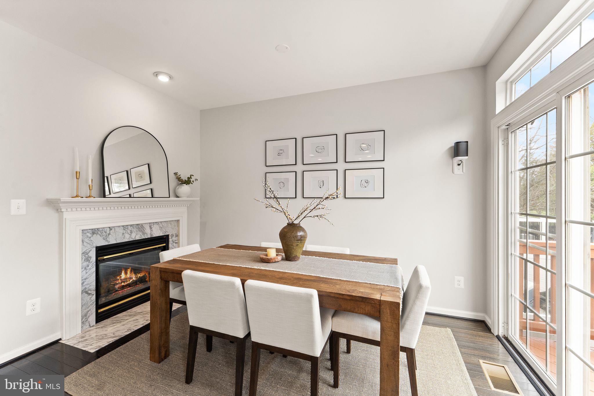 18168 Mill House Square Leesburg, VA 20176 - Photo 10 of 60 a dining room with furniture and a fireplace