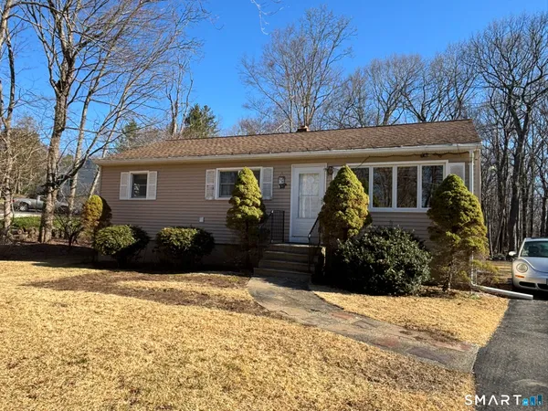 a view of a house with a yard