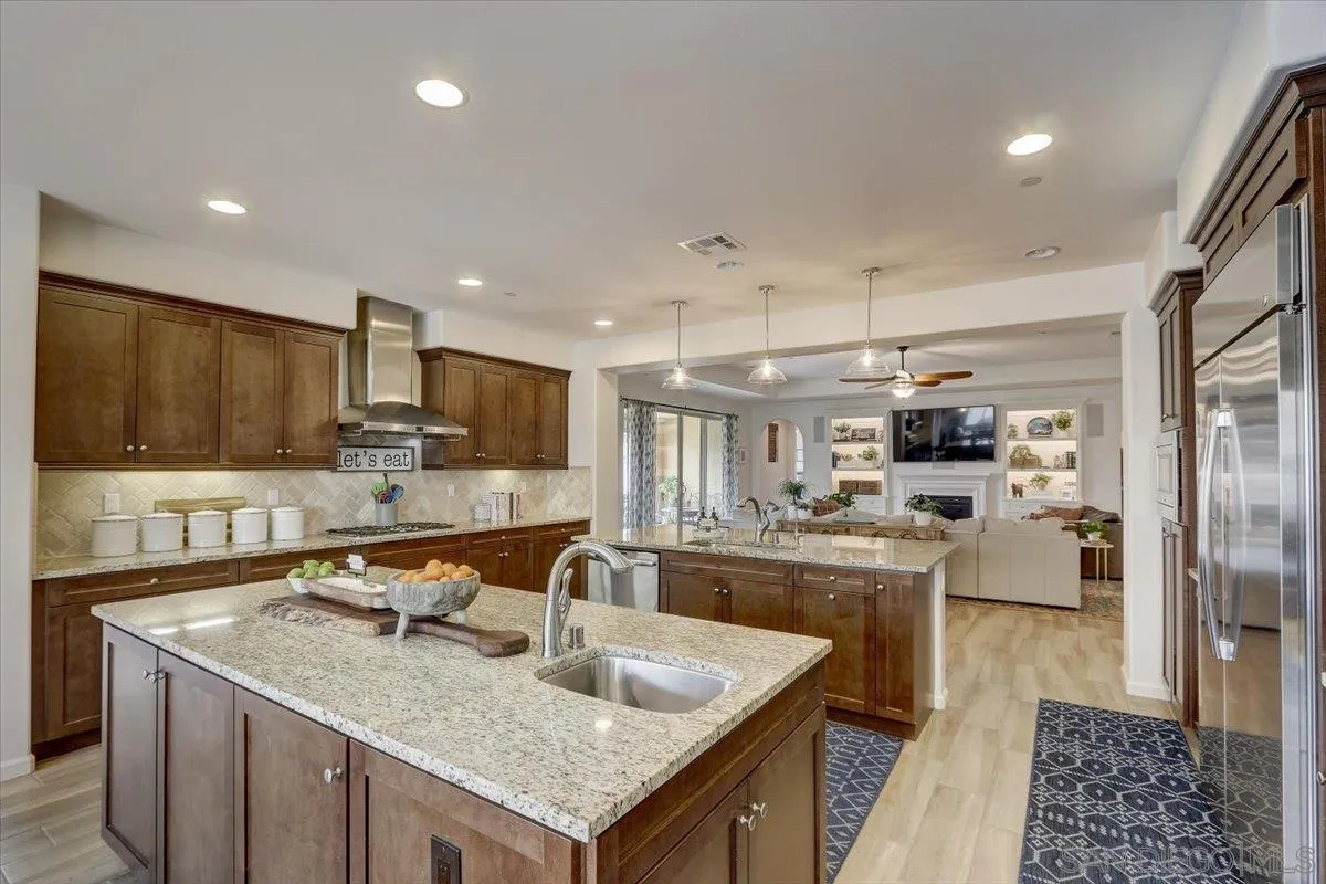 5620 Rancho Del Caballo Bonsall, CA 92003 - Photo 16 of 49 a kitchen with sink stove and refrigerator