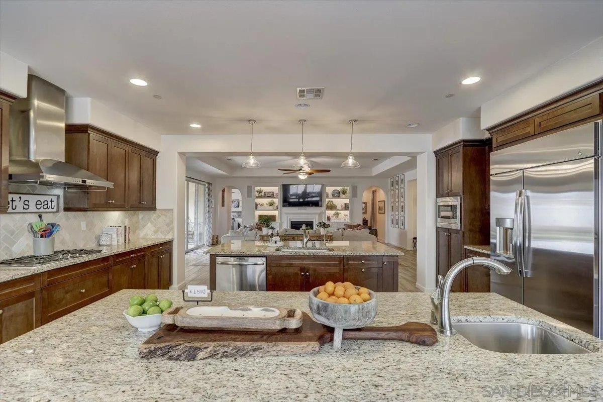 5620 Rancho Del Caballo Bonsall, CA 92003 - Photo 17 of 49 a kitchen with a refrigerator and a sink