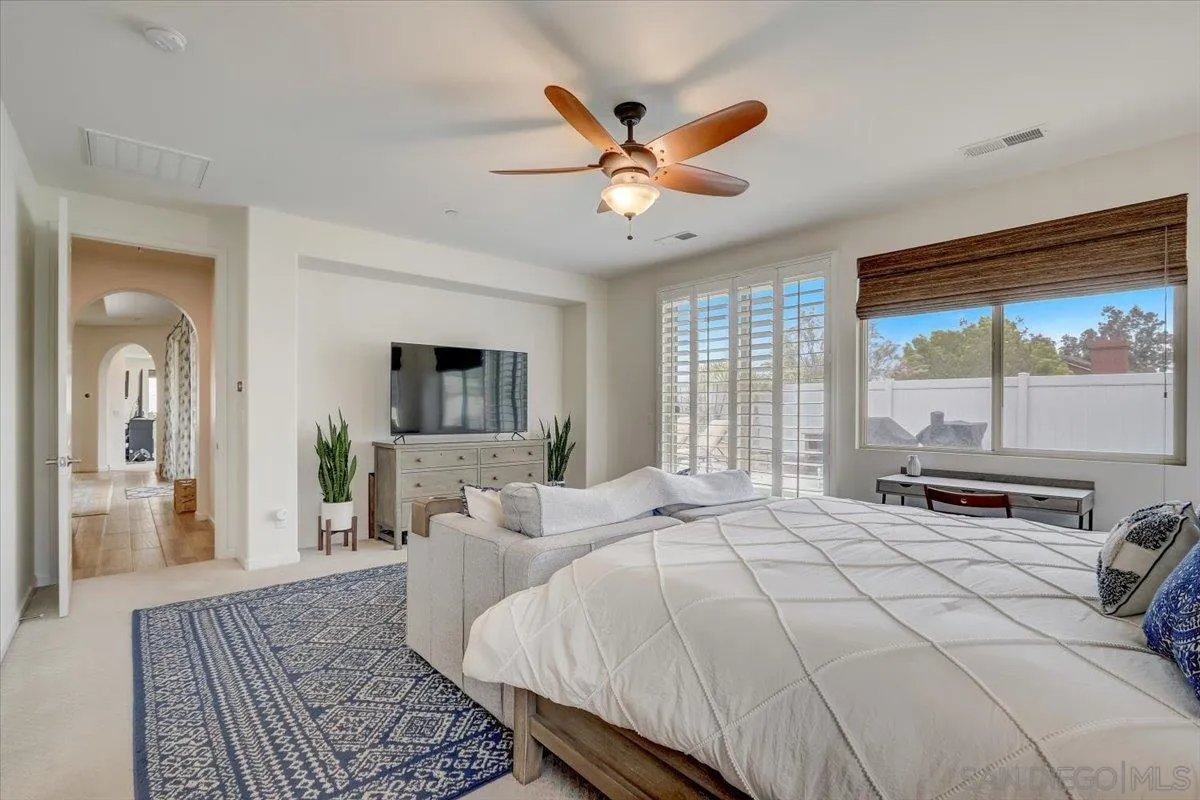 5620 Rancho Del Caballo Bonsall, CA 92003 - Photo 25 of 49 a bed room with a bed and a window