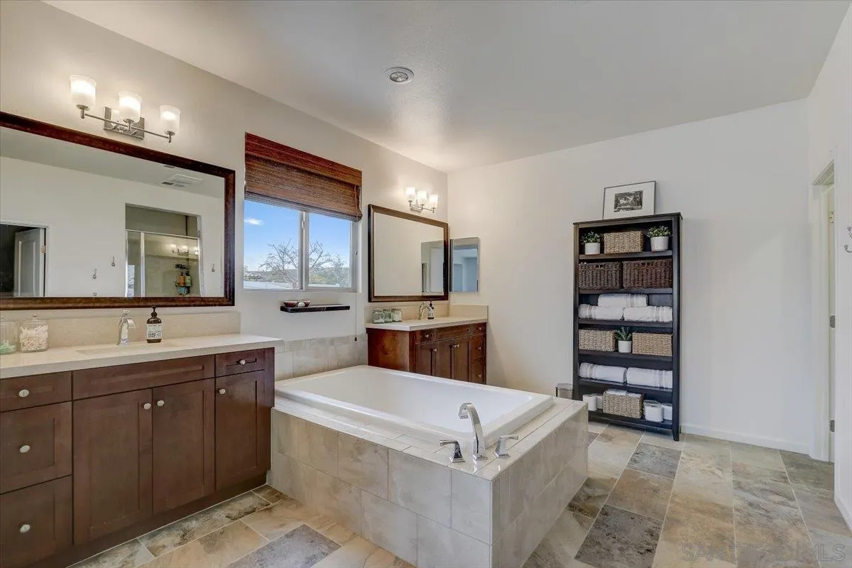 5620 Rancho Del Caballo Bonsall, CA 92003 - Photo 26 of 49 a view of a kitchen with cabinets and stainless steel appliances