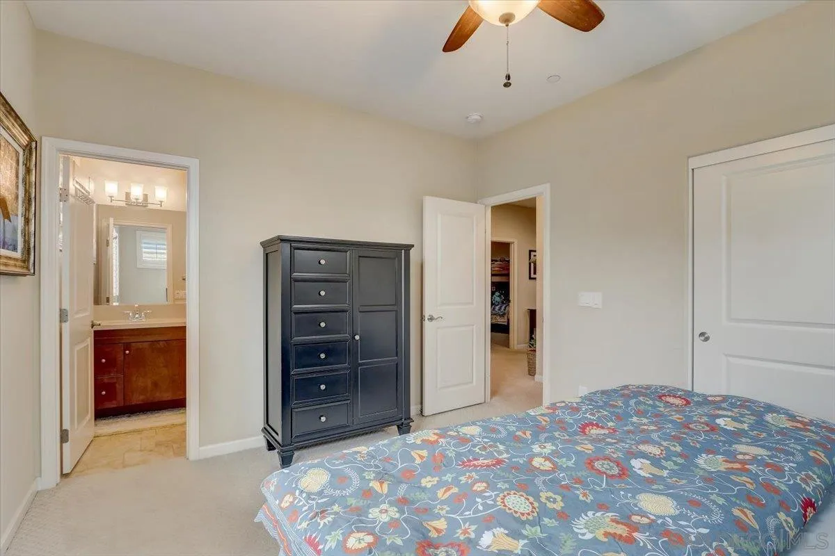 5620 Rancho Del Caballo Bonsall, CA 92003 - Photo 31 of 49 a bedroom with a bed and a dresser