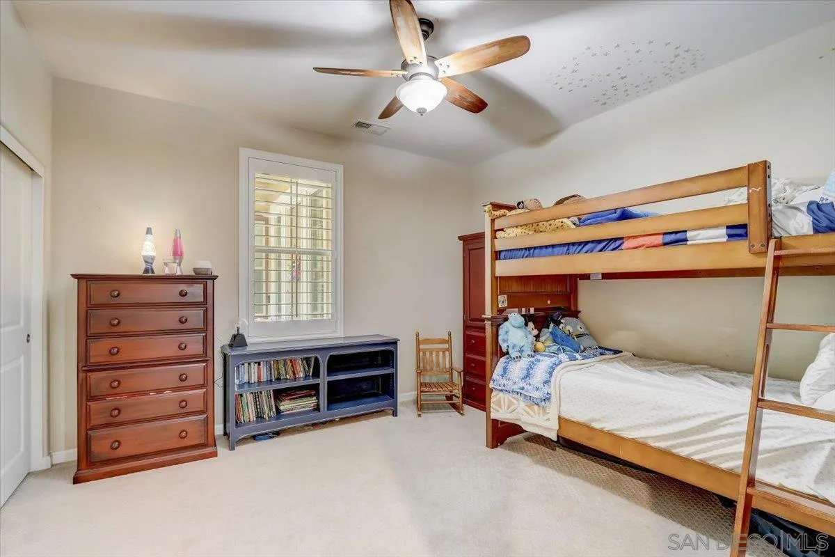 5620 Rancho Del Caballo Bonsall, CA 92003 - Photo 33 of 49 a bedroom with a bed and a cabinets