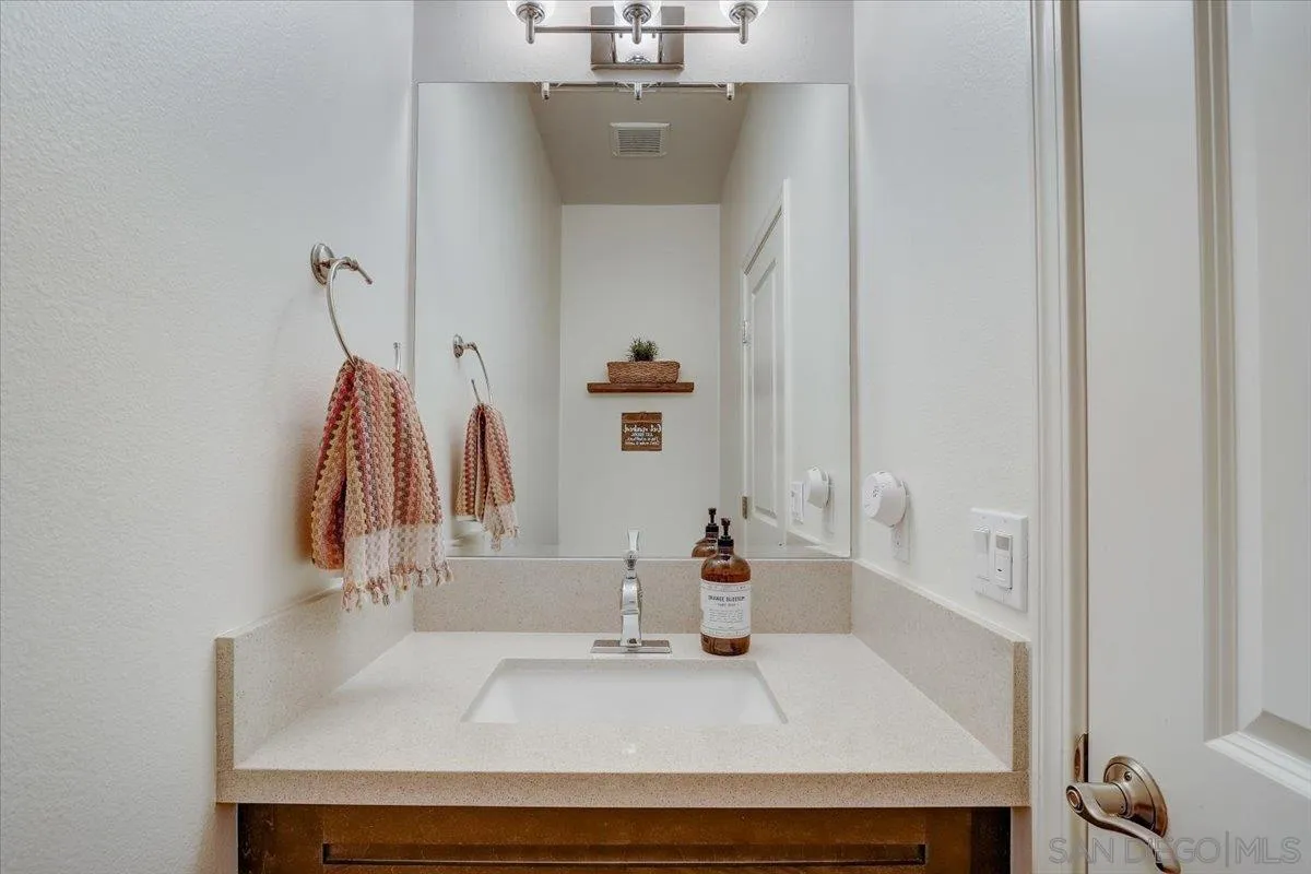 5620 Rancho Del Caballo Bonsall, CA 92003 - Photo 36 of 49 a bathroom with a sink and a mirror