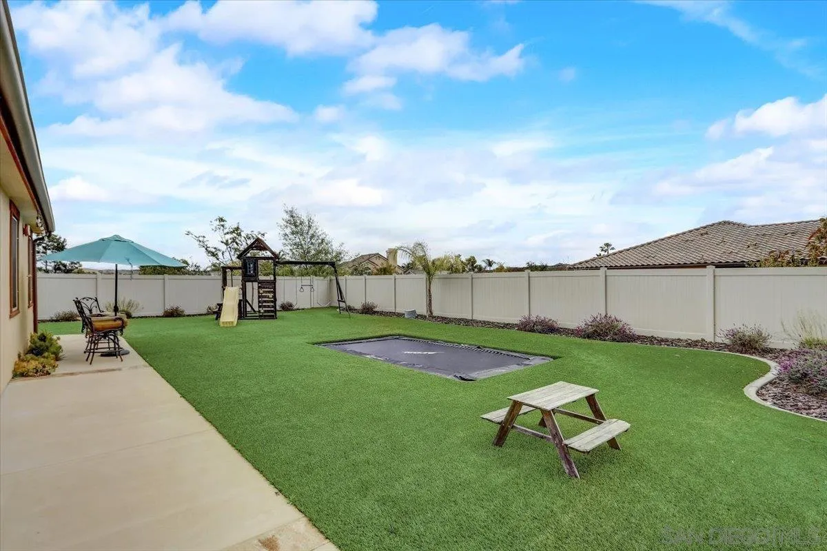 5620 Rancho Del Caballo Bonsall, CA 92003 - Photo 44 of 49 a backyard of a house with table and chairs