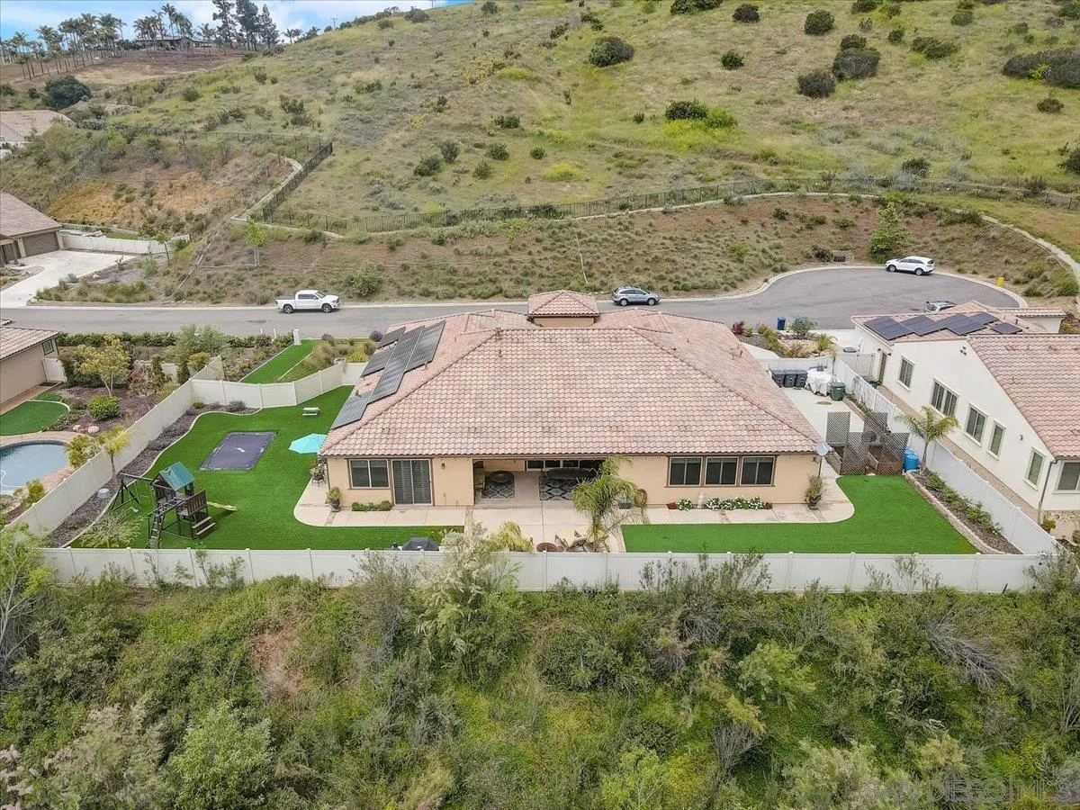 5620 Rancho Del Caballo Bonsall, CA 92003 - Photo 47 of 49 a aerial view of a house with a yard and lake view
