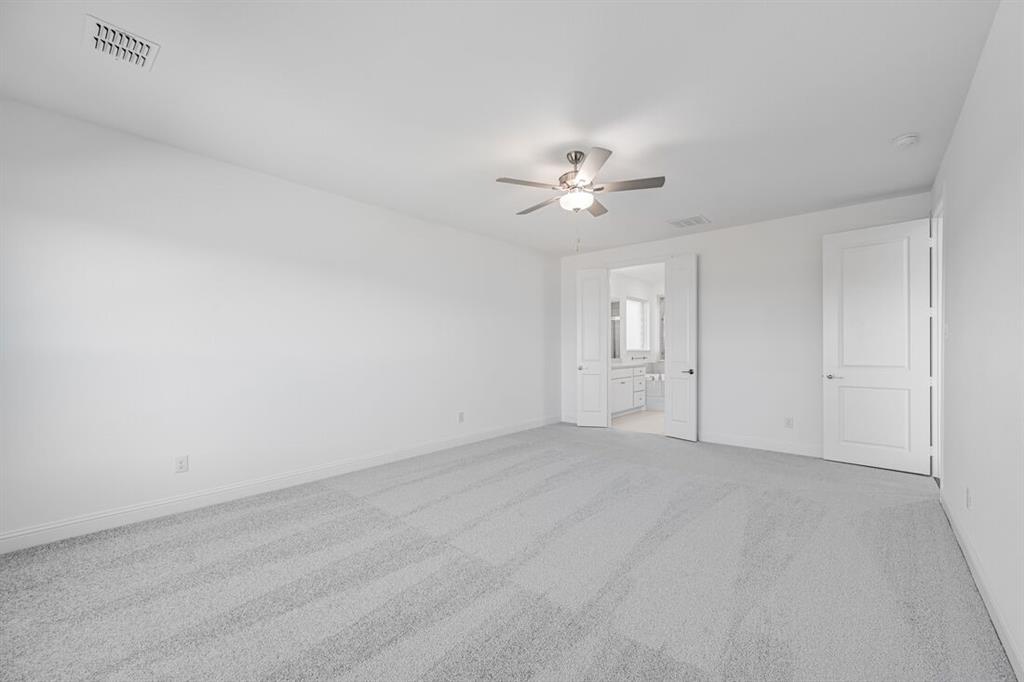 331 Trillium Street Oak Point, TX 75068 - Photo 16 of 36 a view of an empty room with a bathroom