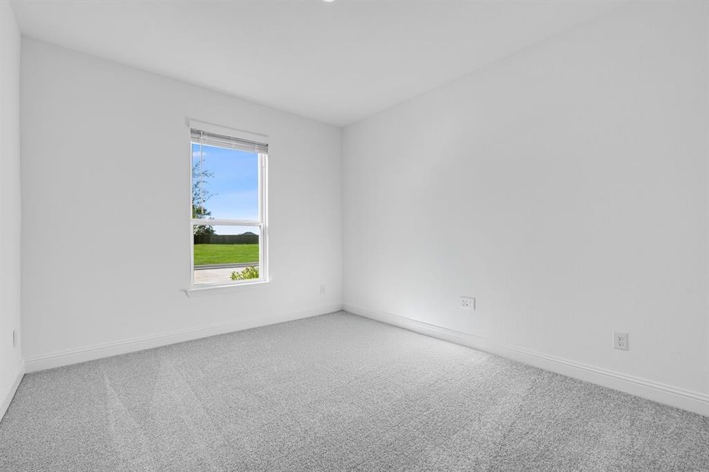 331 Trillium Street Oak Point, TX 75068 - Photo 24 of 36 a view of an empty room with a window