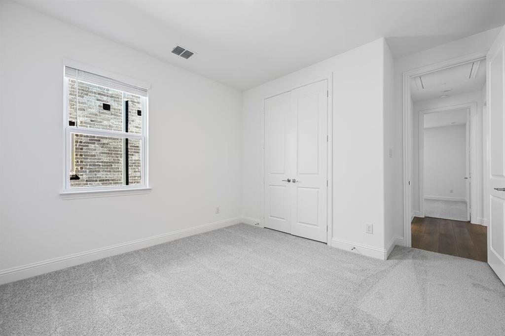 331 Trillium Street Oak Point, TX 75068 - Photo 27 of 36 an empty room with windows