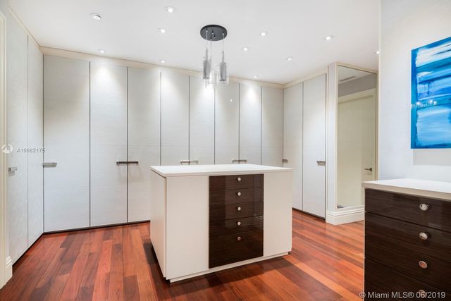 a view of a kitchen with wooden floor