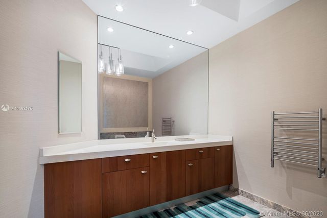 a bathroom with a double vanity sink and mirror