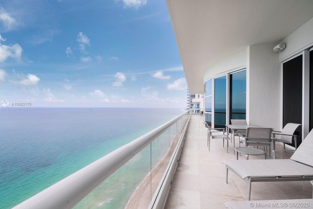 a bathroom with a sink mirror and a bathtub
