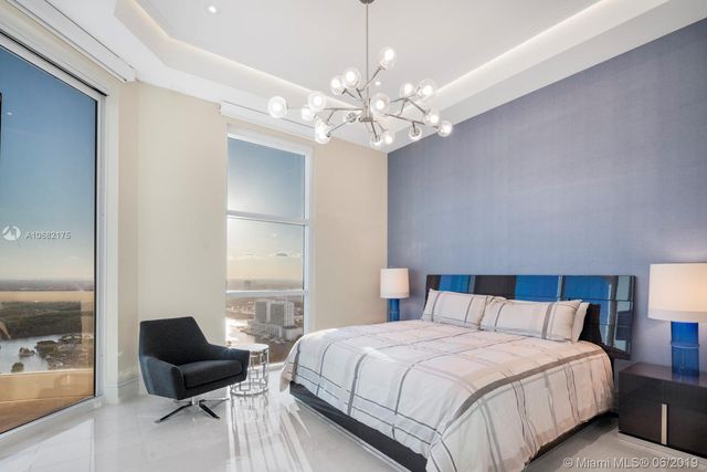 a bedroom with a bed and furniture