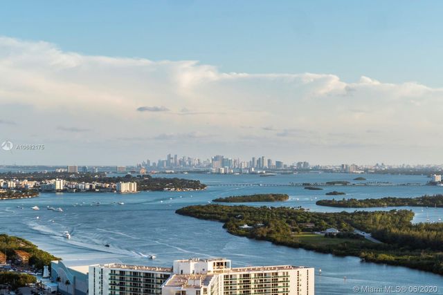 a view of an ocean and city