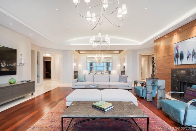 a living room with fireplace furniture and a flat screen tv