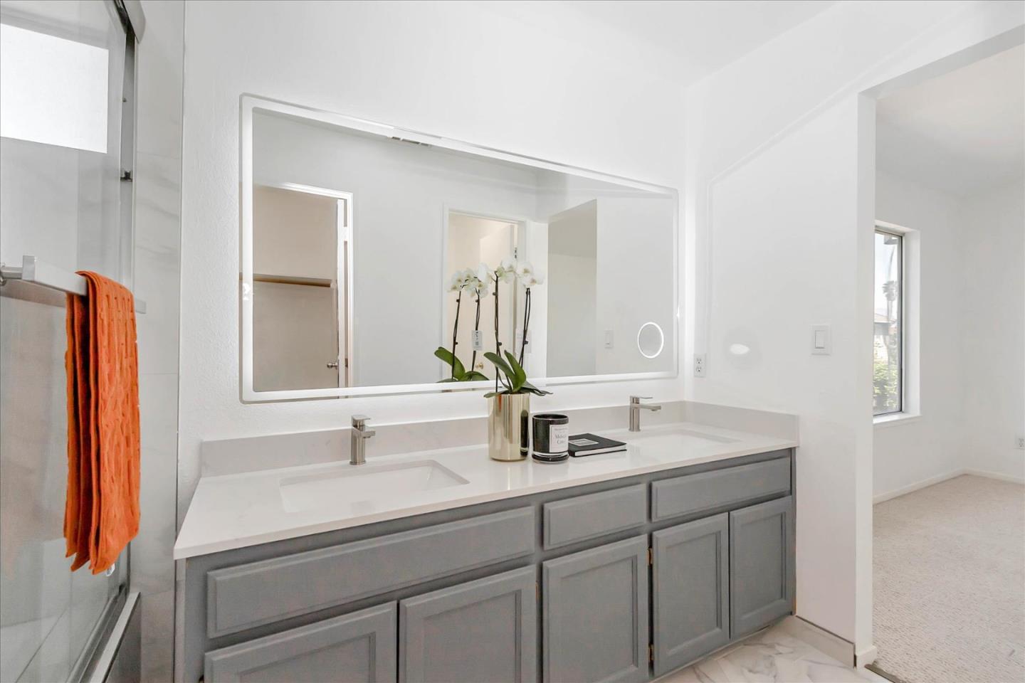 1483 Chavez Way San Jose, CA 95131 - Photo 11 of 40 a bathroom with a sink and a mirror