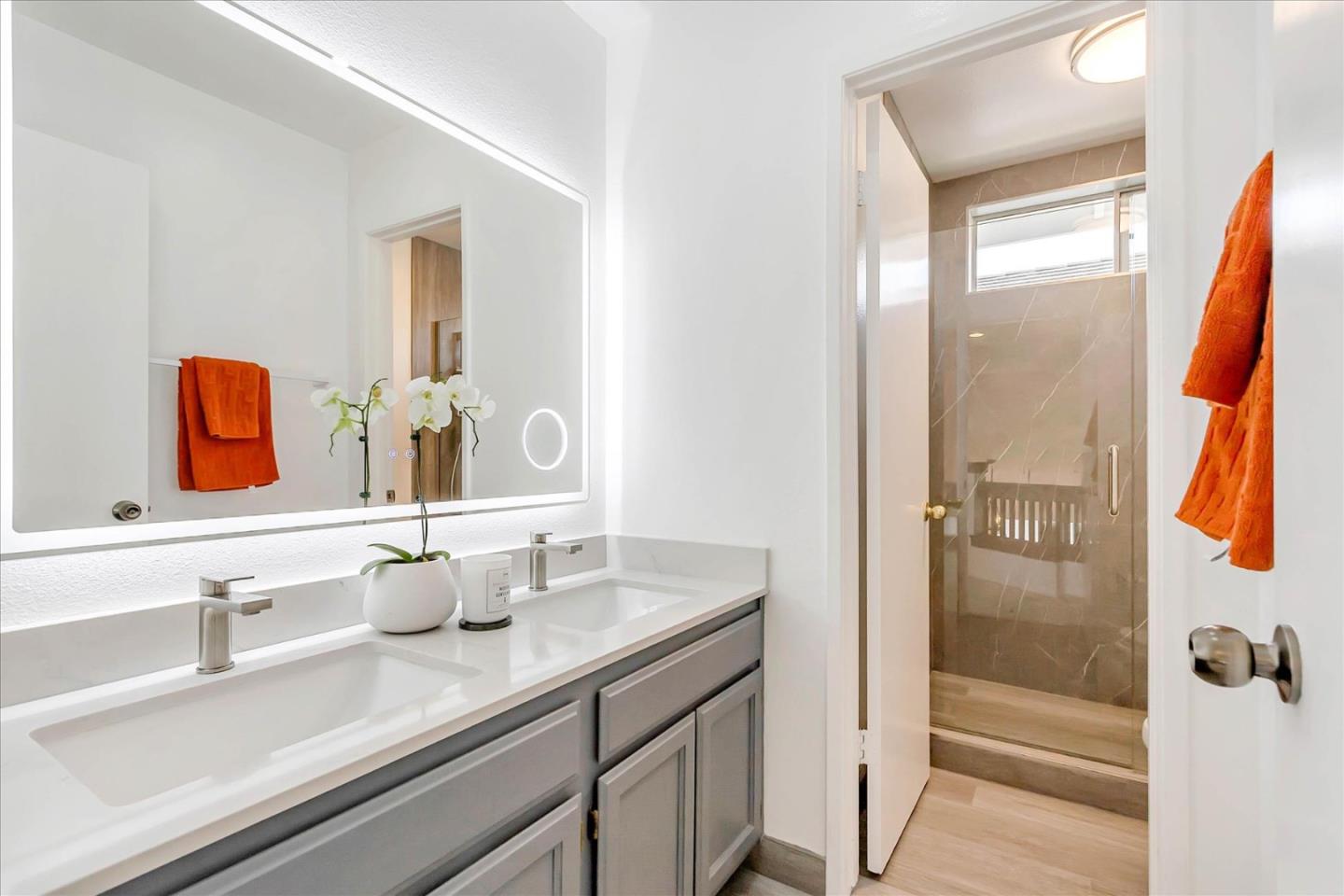 1483 Chavez Way San Jose, CA 95131 - Photo 30 of 40 a bathroom with a sink and a mirror